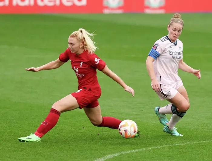 Framed Print : Arsenal's Kim Little Outsmarts Liverpool's Ceri Holland: A Pivotal Moment in the FA WSL Clash Framed Print : Arsenal's Kim Little Outsmarts Liverpool's Ceri Holland: A Pivotal Moment in the FA WSL Clash