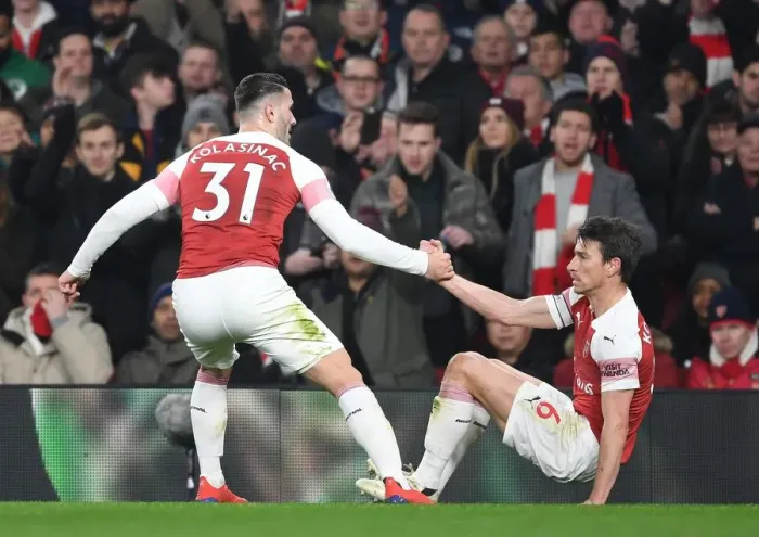 Framed Print : Arsenal's Kolasinac and Koscielny Face Off Against Chelsea in Premier League Showdown