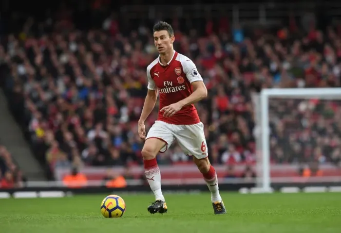 Framed Print : Arsenal's Koscielny in Action against Swansea City (2017-18) Framed Print : Arsenal's Koscielny in Action against Swansea City (2017-18)