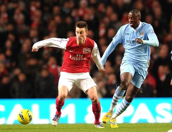 Arsenal's Koscielny Battles Past Yaya Toure in Manchester City Showdown (2011-12 Premier League)