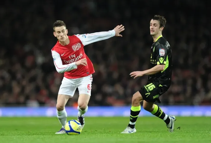 Framed Print : Arsenal's Koscielny Brakes Past Leeds Pugh in FA Cup Clash