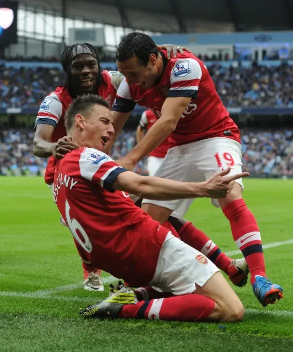Framed Print : Arsenal's Koscielny, Cazorla, and Gervinho Celebrate Goal Against Manchester City Framed Print : Arsenal's Koscielny, Cazorla, and Gervinho Celebrate Goal Against Manchester City