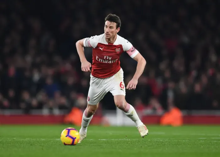 Framed Print : Arsenal's Koscielny Faces Off Against Chelsea in Premier League Showdown Framed Print : Arsenal's Koscielny Faces Off Against Chelsea in Premier League Showdown