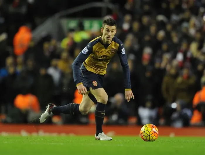 Framed Print : Arsenal's Koscielny Faces Off Against Liverpool at Anfield Stadium (2015-16) Framed Print : Arsenal's Koscielny Faces Off Against Liverpool at Anfield Stadium (2015-16)