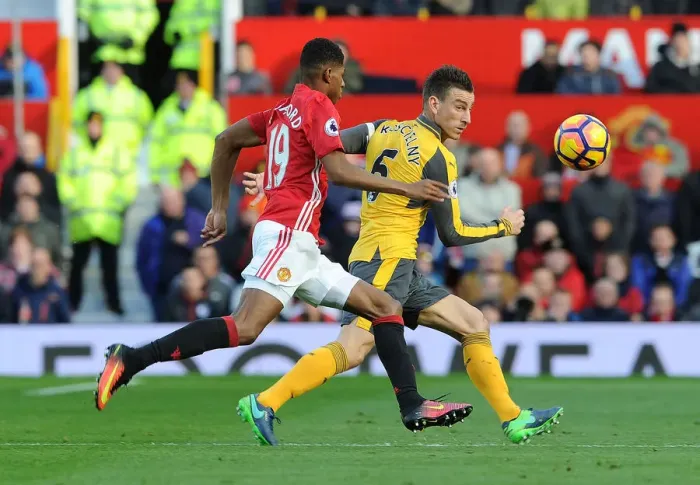 Framed Print : Arsenal's Koscielny Faces Pressure from Rashford in Manchester United Clash (Premier League 2016-17)