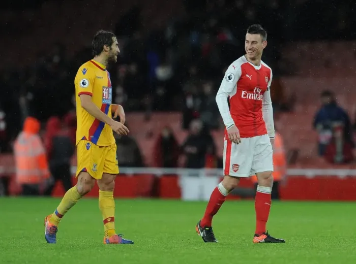 Framed Print : Arsenal's Koscielny and Flamini Share a Moment After Arsenal v Crystal Palace Match, 2016-17
