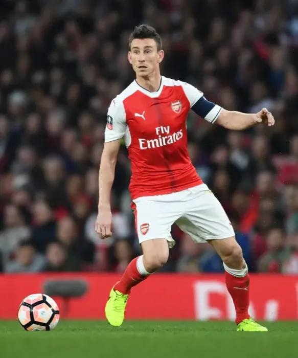 Framed Print : Arsenal's Koscielny Focused in FA Cup Quarter-Final Against Lincoln City Framed Print : Arsenal's Koscielny Focused in FA Cup Quarter-Final Against Lincoln City
