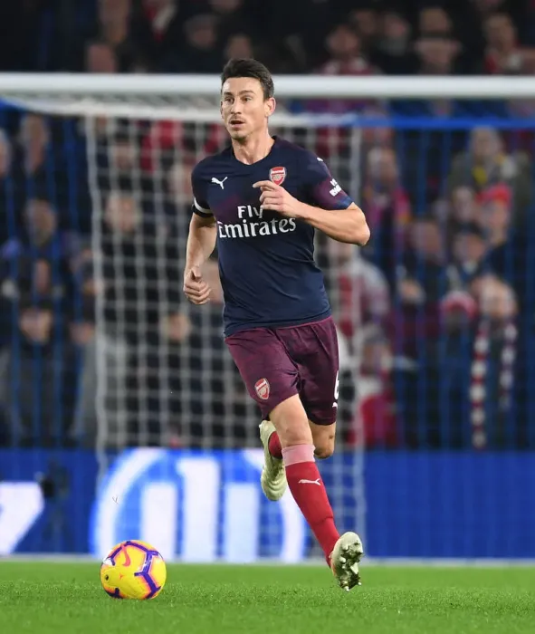 Framed Print : Arsenal's Koscielny Focuses in Intense Premier League Clash Against Brighton Framed Print : Arsenal's Koscielny Focuses in Intense Premier League Clash Against Brighton
