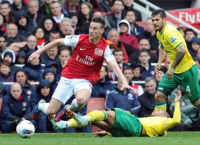 Framed Print : Arsenal's Koscielny Fouls by Norwich's Jackson in 2011-12 Premier League Clash Framed Print : Arsenal's Koscielny Fouls by Norwich's Jackson in 2011-12 Premier League Clash