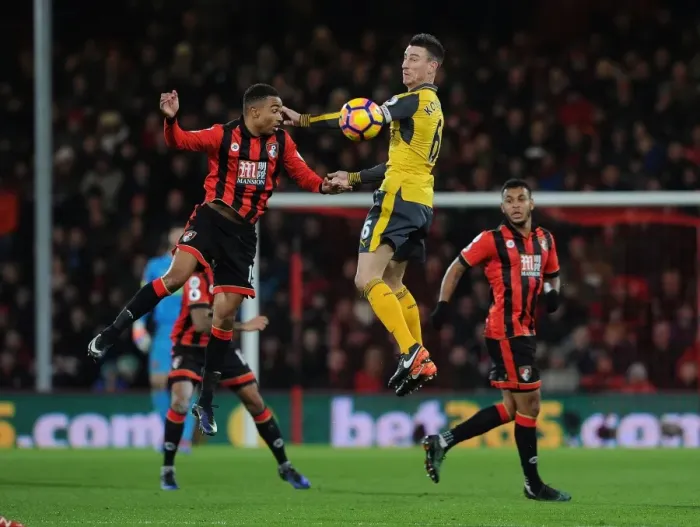 Framed Print : Arsenal's Koscielny Heads Away from Stanislas in AFC Bournemouth Clash (2016-17) Framed Print : Arsenal's Koscielny Heads Away from Stanislas in AFC Bournemouth Clash (2016-17)
