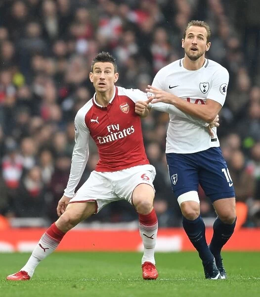 Arsenal's Koscielny Holds Off Tottenham's Kane in Intense Premier League Clash