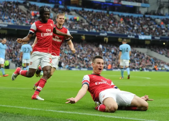 Framed Print : Arsenal's Koscielny, Mertesacker, and Gervinho Celebrate Goal Against Manchester City Framed Print : Arsenal's Koscielny, Mertesacker, and Gervinho Celebrate Goal Against Manchester City