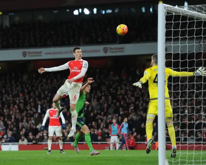 Framed Print : Arsenal's Koscielny Outmuscles Forster: Aerial Battle at Emirates (2016)