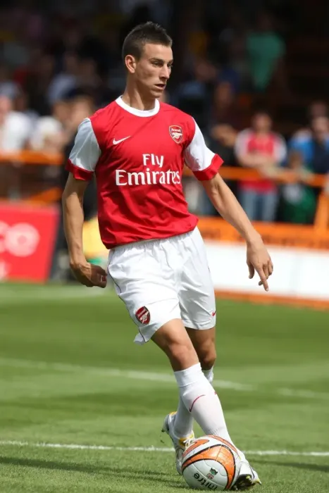 Framed Print : Arsenal's Koscielny Shines in 4-0 Pre-Season Victory over Barnet