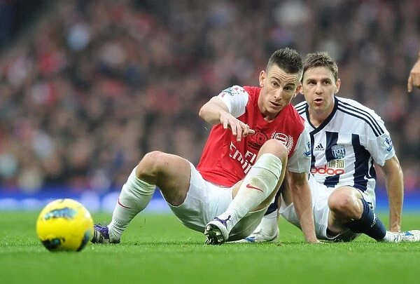 Arsenal's Koscielny Tackles Gera in Intense Arsenal vs. West Bromwich Albion Clash (2011-12)