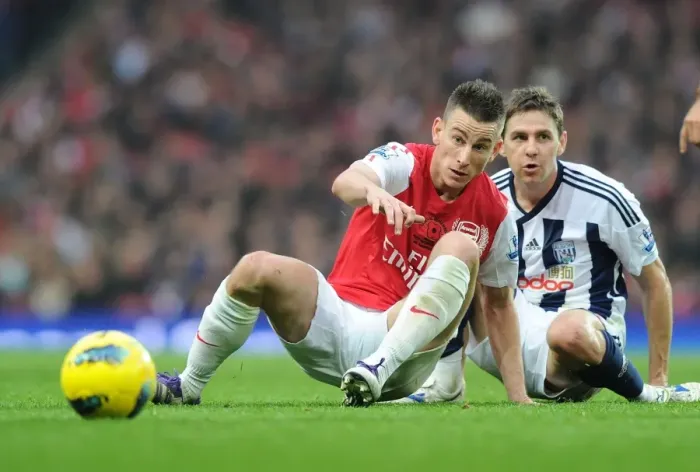 Framed Print : Arsenal's Koscielny Tackles Gera in Intense Arsenal vs. West Bromwich Albion Clash (2011-12)