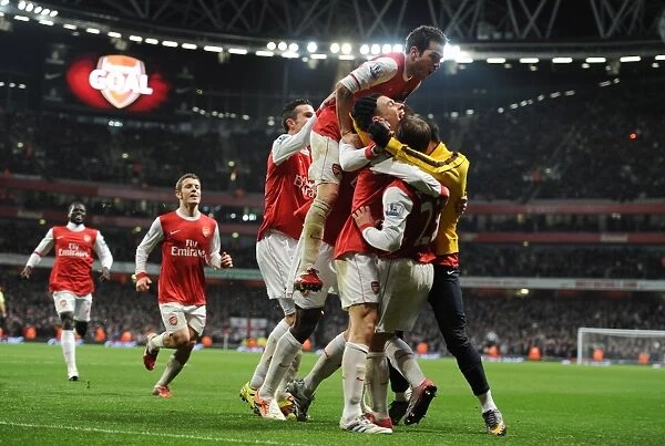 Arsenal's Koscielny and Teams Celebrate Carling Cup Semi-Final Goal Against Ipswich