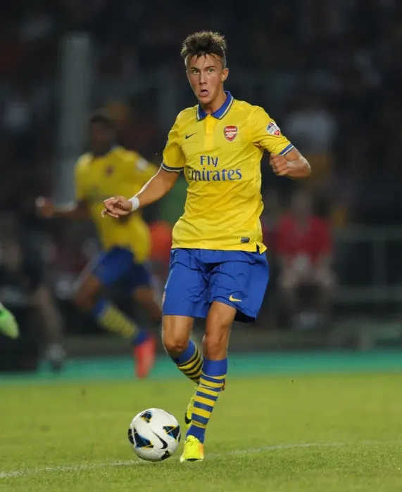 Framed Print : Arsenal's Kris Olsson in Action against Indonesia Dream Team (2013-14)