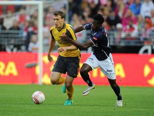 Arsenal's Krystian Bielik Outmuscles Usman Sala in Exciting Pre-Season Clash