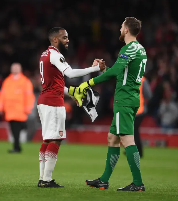 Framed Print : Arsenal's Lacazette and Atletico's Oblak Exchange Handshakes in Europa League Semi-Final