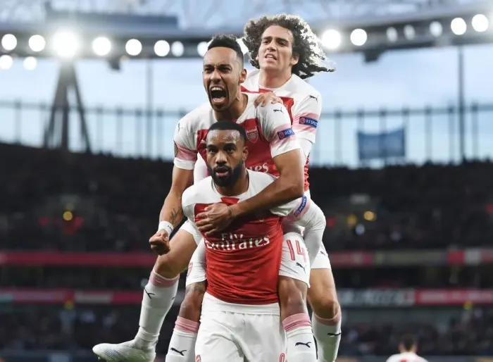 Framed Print : Arsenal's Lacazette, Aubameyang, and Guendouzi Celebrate Goal in Europa League Semi-Final vs Valencia