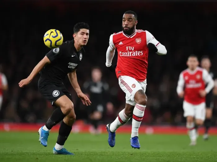 Framed Print : Arsenal's Lacazette Clashes with Brighton's Alzate in Premier League Showdown Framed Print : Arsenal's Lacazette Clashes with Brighton's Alzate in Premier League Showdown