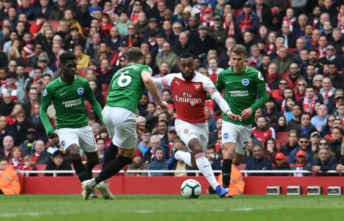 Framed Print : Arsenal's Lacazette Clashes with Brighton's Defenders during Premier League Showdown Framed Print : Arsenal's Lacazette Clashes with Brighton's Defenders during Premier League Showdown