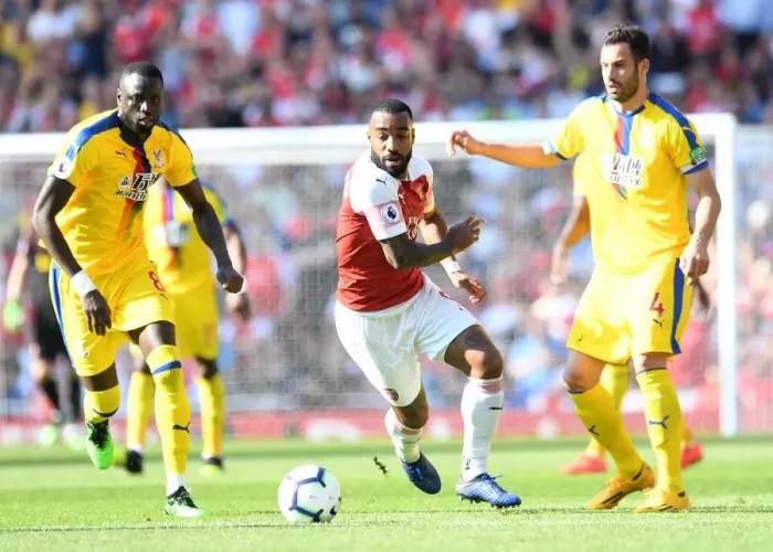 Framed Print : Arsenal's Lacazette Clashes with Kouyate and Milivojevic of Crystal Palace Framed Print : Arsenal's Lacazette Clashes with Kouyate and Milivojevic of Crystal Palace