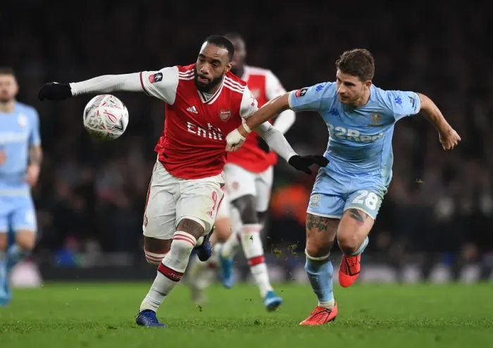 Framed Print : Arsenal's Lacazette Clashes with Leeds Berardi in FA Cup Showdown Framed Print : Arsenal's Lacazette Clashes with Leeds Berardi in FA Cup Showdown