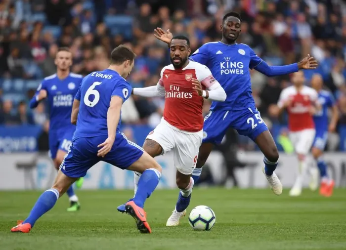 Framed Print : Arsenal's Lacazette Clashes with Leicester's Evans and Ndidi in Premier League Showdown Framed Print : Arsenal's Lacazette Clashes with Leicester's Evans and Ndidi in Premier League Showdown