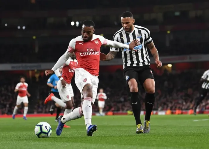 Framed Print : Arsenal's Lacazette Clashes with Newcastle's Lascelles in Premier League Showdown Framed Print : Arsenal's Lacazette Clashes with Newcastle's Lascelles in Premier League Showdown