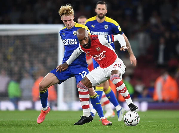 Arsenal's Lacazette Clashes with Rudoni in Carabao Cup Battle at Emirates Stadium