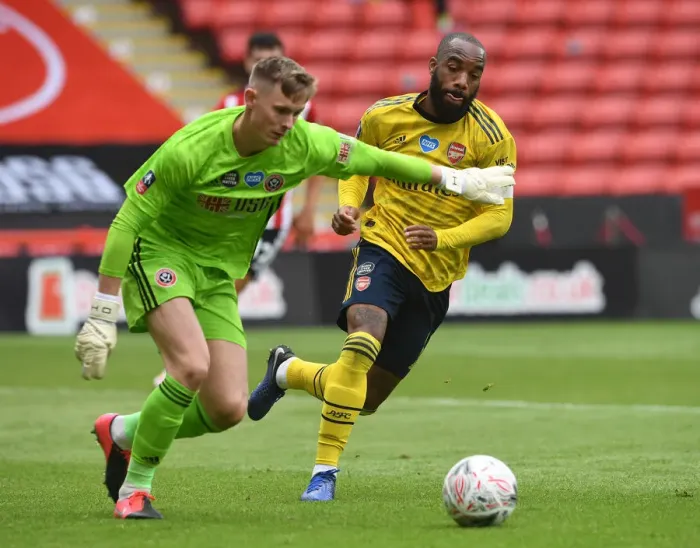 Framed Print : Arsenal's Lacazette Closes In on Sheffield United's Henderson in FA Cup Quarterfinal Showdown