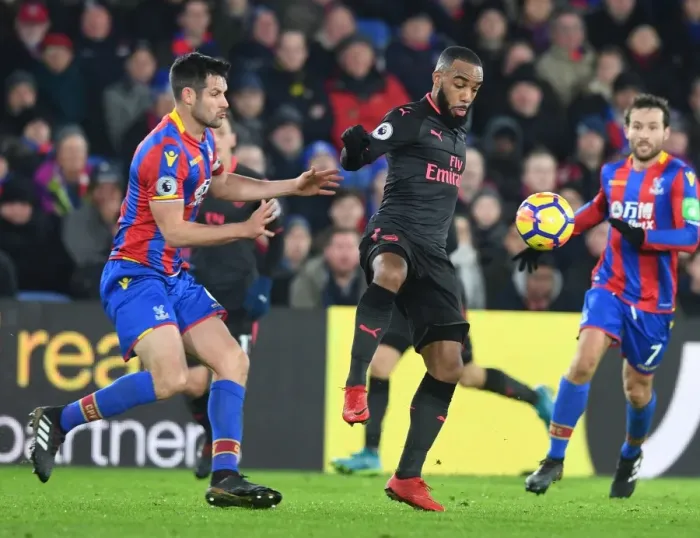 Framed Print : Arsenal's Lacazette and Crystal Palace's Dann Clash in Intense Premier League Showdown Framed Print : Arsenal's Lacazette and Crystal Palace's Dann Clash in Intense Premier League Showdown