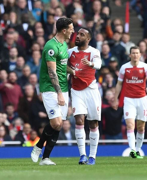 Arsenal's Lacazette and Dunk in Deep Conversation During Arsenal v Brighton Match