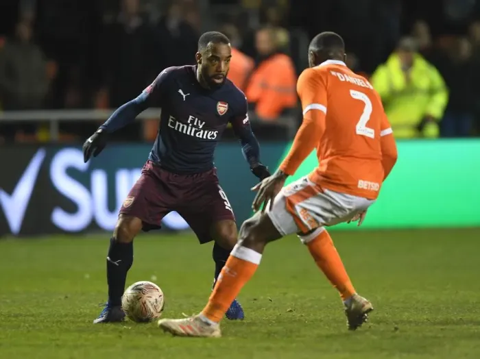 Framed Print : Arsenal's Lacazette Faces Off Against Blackpool's Daniels in FA Cup Clash
