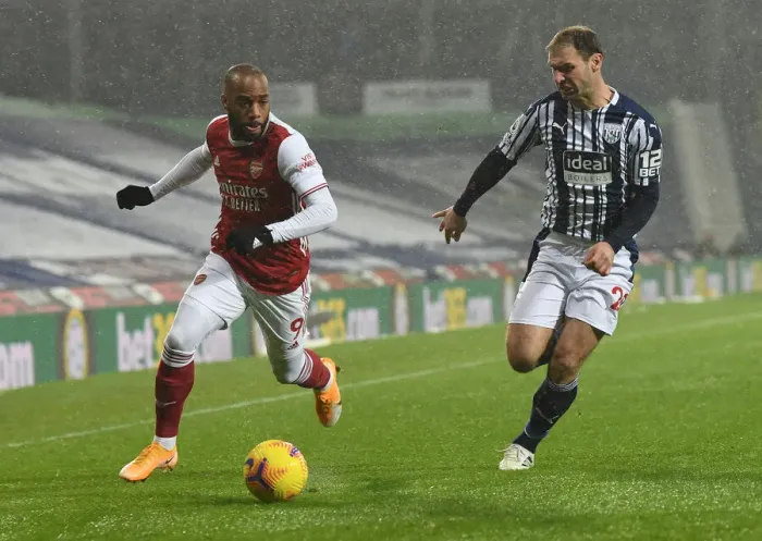 Framed Print : Arsenal's Lacazette Faces Off Against Ivanovic in West Bromwich Albion vs Arsenal Clash (2020-21) Framed Print : Arsenal's Lacazette Faces Off Against Ivanovic in West Bromwich Albion vs Arsenal Clash (2020-21)