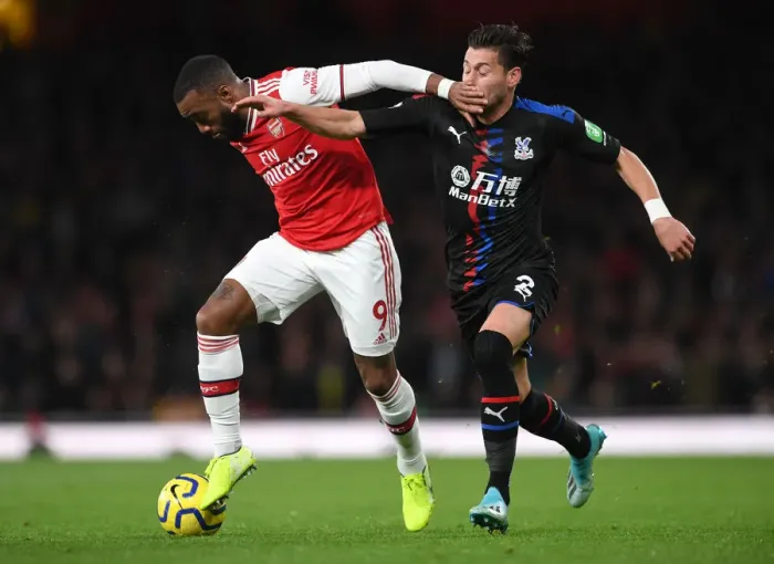 Framed Print : Arsenal's Lacazette Fends Off Palace's Ward in Premier League Clash