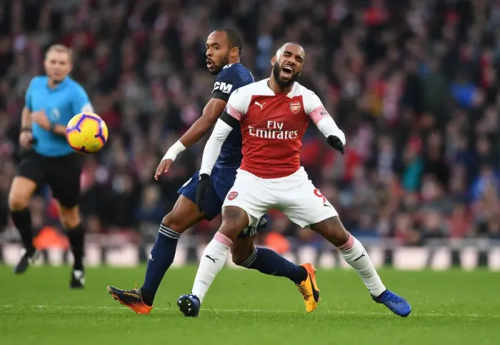 Framed Print : Arsenal's Lacazette Fouls by Fulham's Odoi in Premier League Clash