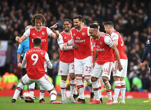 Arsenal's Lacazette, Luiz, Mari, and Aubameyang Celebrate Goal Against West Ham United