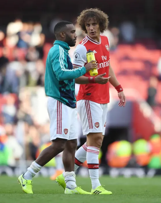 Framed Print : Arsenal's Lacazette and Luiz: Victory Celebration Against Tottenham Framed Print : Arsenal's Lacazette and Luiz: Victory Celebration Against Tottenham