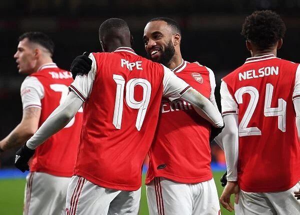 Arsenal's Lacazette and Pepe Celebrate Goal Against Leeds United in FA Cup Third Round