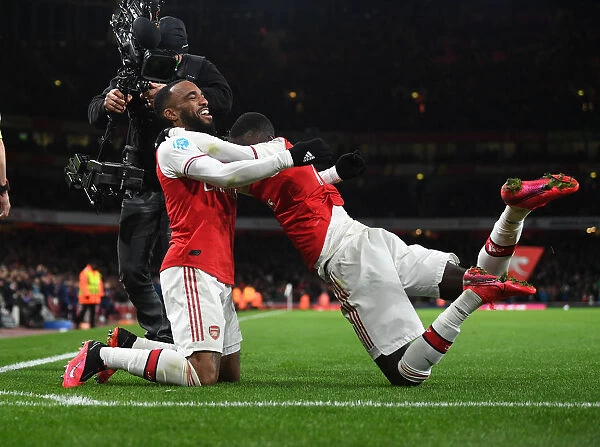 Arsenal's Lacazette and Pepe Celebrate Goals Against Newcastle United (2019-20)
