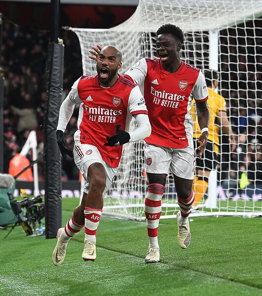 Arsenal's Lacazette and Saka Celebrate Goals Against Wolverhampton Wanderers in Premier League Match