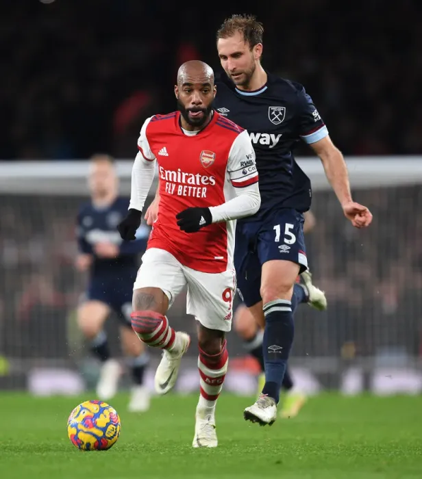 Framed Print : Arsenal's Lacazette Scores Past West Ham's Dawson in Premier League Clash