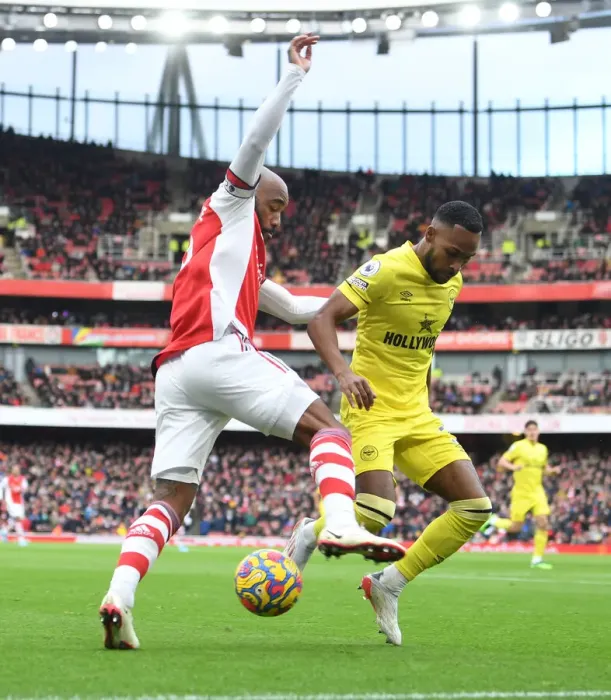 Framed Print : Arsenal's Lacazette vs. Henry: A Legendary Clash on the Emirates Field