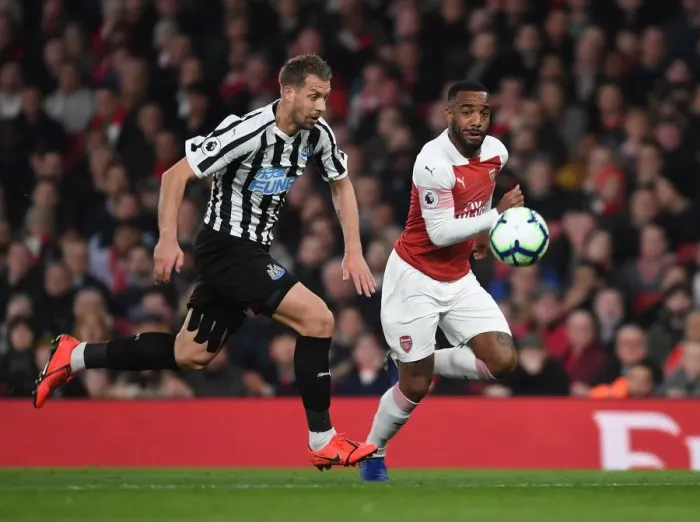 Framed Print : Arsenal's Lacazette vs. Newcastle's Lejeune: A Premier League Showdown Framed Print : Arsenal's Lacazette vs. Newcastle's Lejeune: A Premier League Showdown