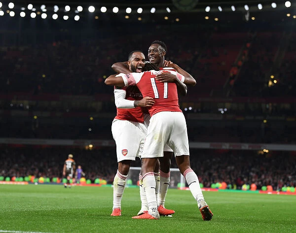 Arsenal's Lacazette, Welbeck, and Iwobi Celebrate Goals Against Brentford in Carabao Cup