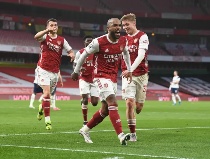 Framed Print : Arsenal's Lacazette, Xhaka, and Smith Rowe Celebrate Goals Against Tottenham in Empty Emirates Stadium Framed Print : Arsenal's Lacazette, Xhaka, and Smith Rowe Celebrate Goals Against Tottenham in Empty Emirates Stadium
