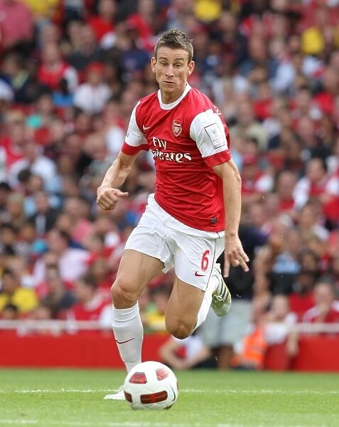 Arsenal's Laurent Koscielny in Action Against AC Milan: A 1-1 Draw at Emirates Cup, 2010